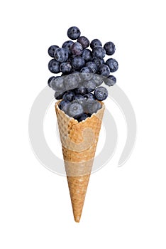 Waffle ice cream cone with fresh blueberry fruits