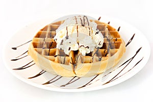 Waffle and ice cream on white dish