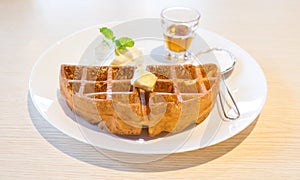 Waffle with maple syrup and butter