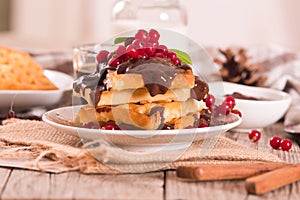 Waffle with red currant and chocolate topping