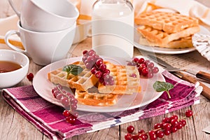 Waffle with red currant and honey.