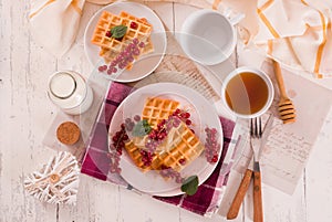 Waffle with red currant and honey.