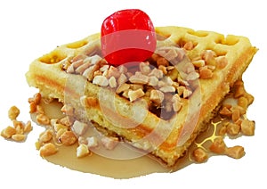 A waffle served with Cherry, peanuts and honey