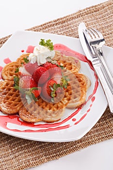 Waffle topping with strawberry and decoration