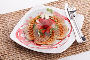 Waffle topping with strawberry and decoration