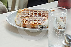 Waffle on a white plate. photo