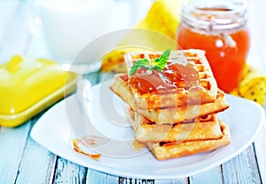 Waffles with apricot jam