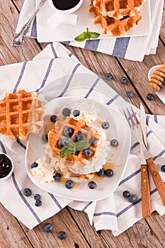 Waffles with blueberries and chocolate cream