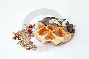 Waffles with chocolate, nut and granola white background.