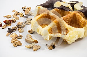 Waffles with chocolate, nut and granola white background.
