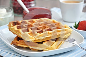 Waffles with cream and strawberries