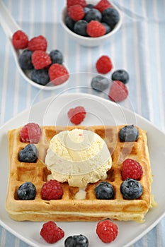 Waffles with ice cream and berries