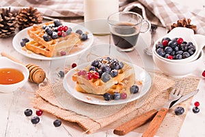 Waffles with red currant and blueberries