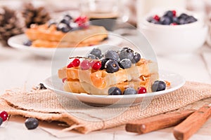 Waffles with red currant and blueberries