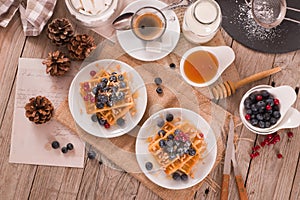 Waffles with red currant and blueberries