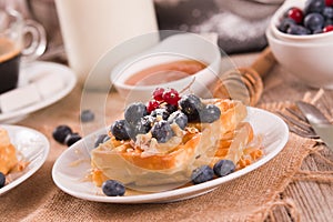 Waffles with red currant and blueberries