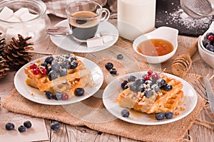 Waffles with red currant and blueberries