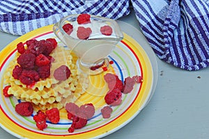 Waffles with sour cream and raspberries