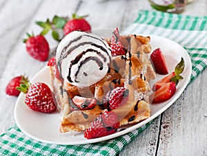 Waffles with strawberries and ice cream