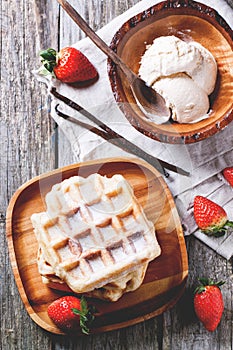 Waffles with strawberries and ice cream