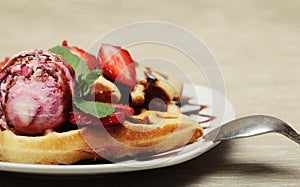 Waffles with strawberry and ice cream