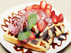Waffles with strawberry and ice cream