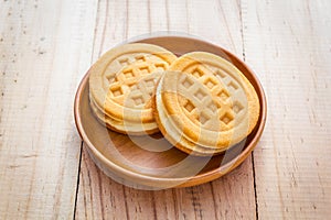 Waffles in wood dish on wood table