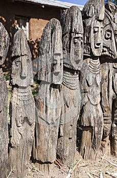 Waga - carved wooden grave markers. Arfaide (near Karat Konso). Ethiopia.