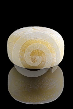 Wagashi mochi with Mango on black background. Copy space