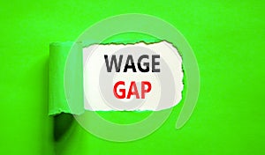 Wage gap symbol. Concept words Wage gap on beautiful white paper on a beautiful green background. Business, support and wage gap