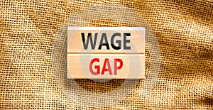 Wage gap symbol. Concept words Wage gap on wooden blocks on a beautiful canvas table canvas background. Business, support and wage