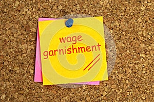 Wage garnishment postit on cork