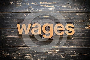 Wages Concept Vintage Wooden Letterpress Type Word photo