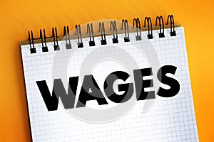 Wages - payment made by an employer to an employee for work done in a specific period of time, text concept on notepad