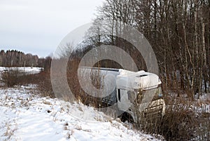 The wagon drove off the road into the ditch. Accident on the road. Emergency ride in winter.