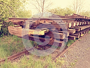 Wagon with extracted old railways. Concrete and wooden sleepers with rail rods