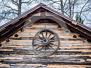 Wagon Wheel on Log Cabin