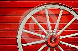 Wagon Wheel by Painted Red Wall