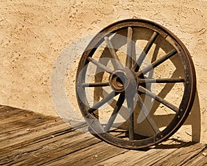 Wagon Wheel Wheel Against a Stucco Wall in Arizona