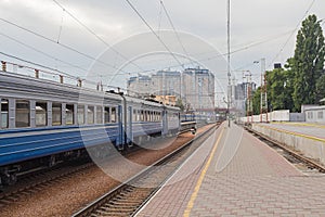 Wagons in a train station and an empty platform