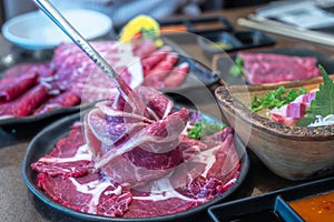 wagyu beef in plate on korean barbeque table in Japanese restaurant