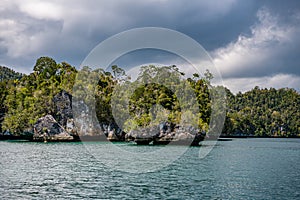 Waigeo, Kri, Mushroom Island, group of small islands in shallow blue lagoon water