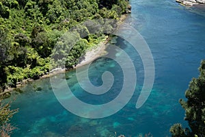 Waikato River below in natural landscape at Taupo