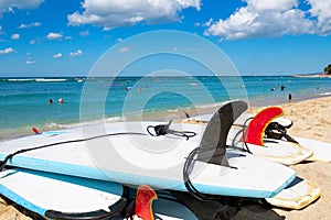 Waikiki beach in Honolulu, Hawaii, with surfboards and ocean view