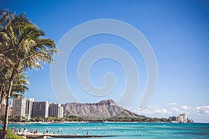 Waikiki Beach with view of Diamond Head - volcanic cone on Oahu, Hawaii