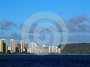 Waikiki Hotels and Diamond Head Crater during the day along the shore seen from the ocean