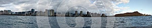 Waikiki Hotels and Diamond Head Crater during the day along the shore seen from the ocean