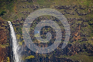 Waipo’o Falls at Waimea Canyon getting a close look from a helicopter.