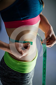 Waist measurement with green tape