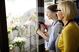 Two Female Florists Choosing Flowers